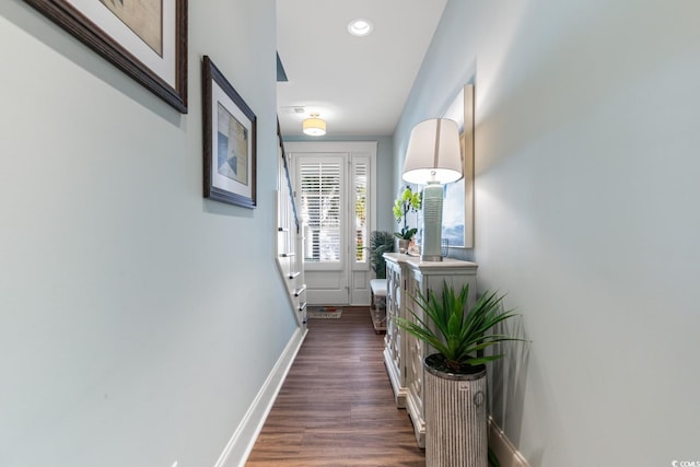 hallway with dark wood-type flooring