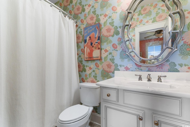 bathroom featuring vanity and toilet