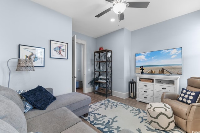 living room with hardwood / wood-style floors and ceiling fan