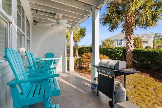 view of patio featuring ceiling fan and a grill