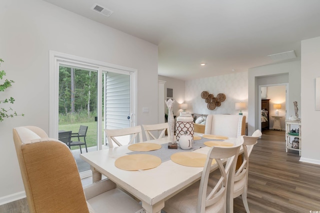 dining space featuring dark wood-type flooring