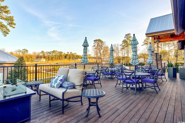 wooden terrace featuring an outdoor hangout area