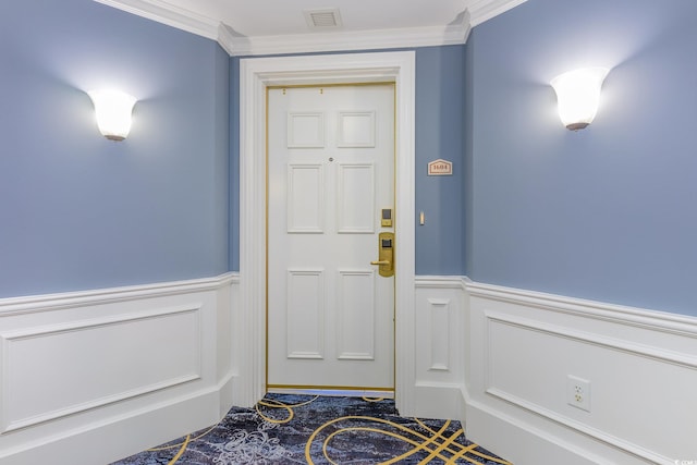 doorway featuring crown molding