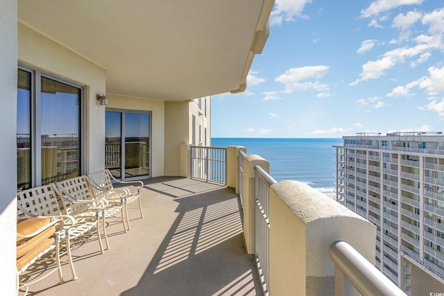 balcony featuring a water view