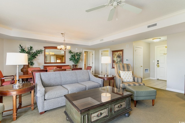 living room with light colored carpet, crown molding, and a tray ceiling