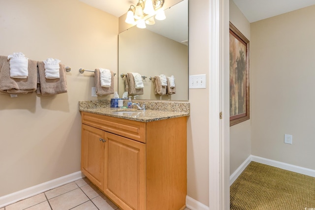 bathroom featuring tile patterned flooring and vanity