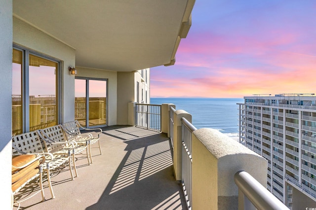 balcony at dusk with a water view