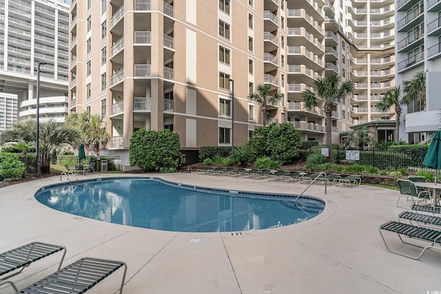 view of swimming pool featuring a patio