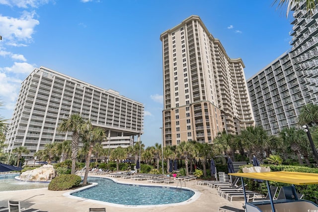 view of swimming pool featuring a patio area