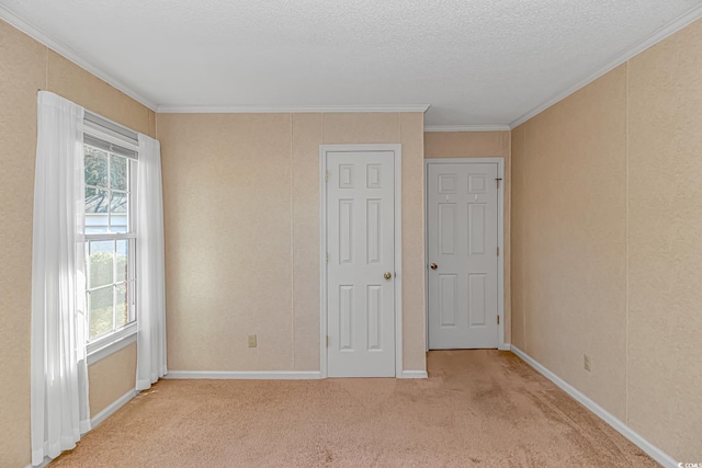 5080 Forest Dr, Loris, SC 29569 - unfurnished bedroom featuring light colored carpet, crown molding, and a textured ceiling