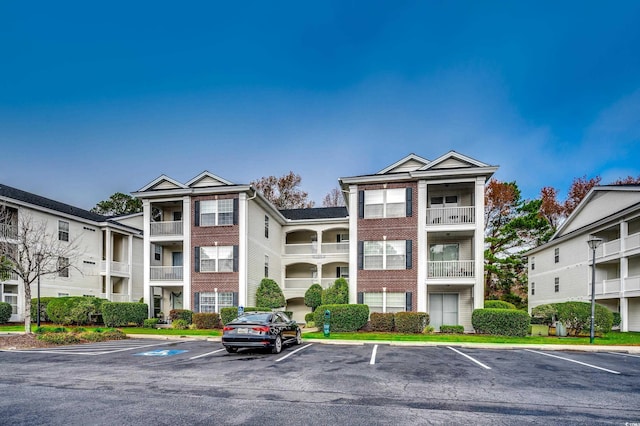1286 River Oaks Dr Unit 8-M, Myrtle Beach, SC 29579 - view of property featuring uncovered parking