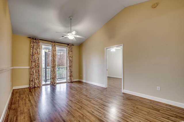 spare room with ceiling fan, high vaulted ceiling, and light hardwood / wood-style flooring