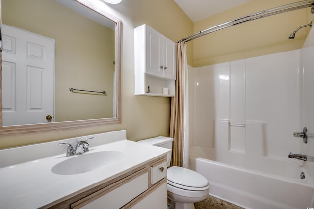 full bathroom with vanity, shower / bath combo, and toilet