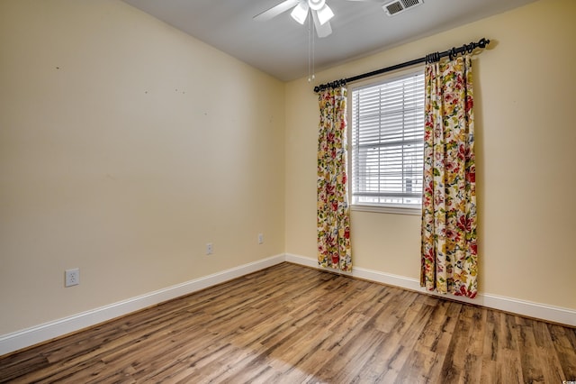 1286 River Oaks Dr Unit 8-M, Myrtle Beach, SC 29579 - spare room with wood finished floors and ceiling fan