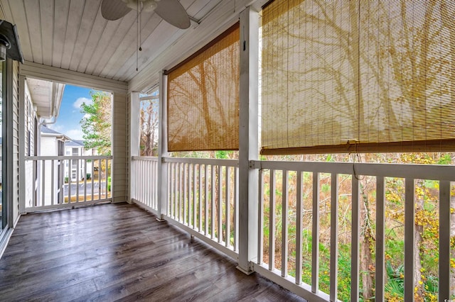 unfurnished sunroom featuring ceiling fan and wood ceiling