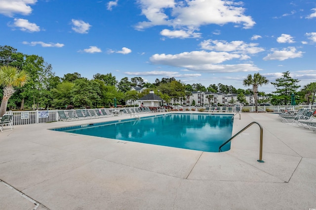 view of swimming pool featuring a patio area