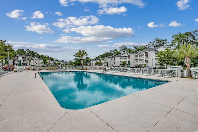 view of swimming pool with a patio