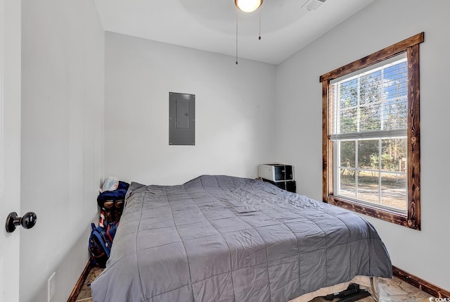 bedroom featuring electric panel and ceiling fan