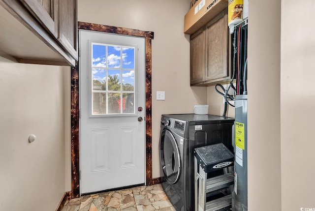 laundry room featuring washer and dryer and cabinets