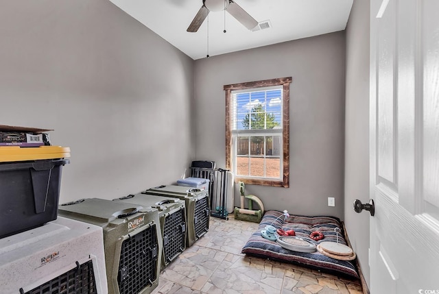 interior space featuring ceiling fan