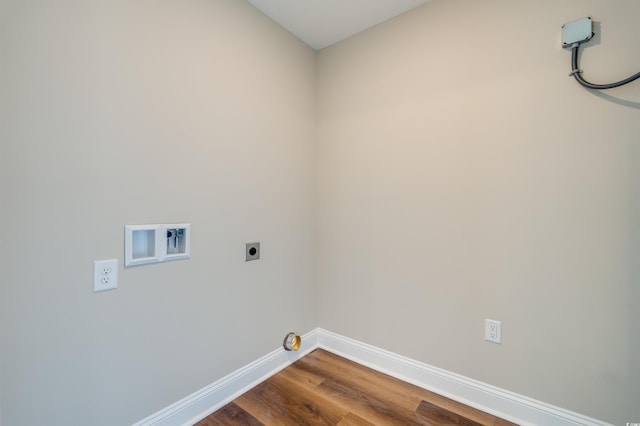 clothes washing area featuring hardwood / wood-style flooring, electric dryer hookup, and washer hookup