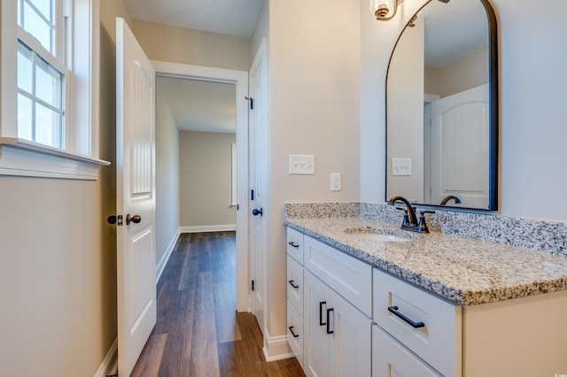 bathroom with vanity and wood-type flooring