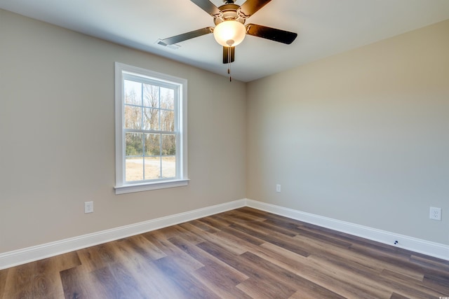 empty room featuring hardwood / wood-style flooring and ceiling fan