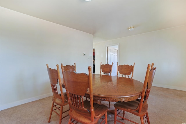 view of carpeted dining area