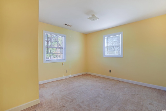 empty room featuring light colored carpet