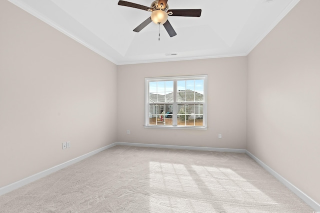 empty room with light colored carpet, ceiling fan, and crown molding