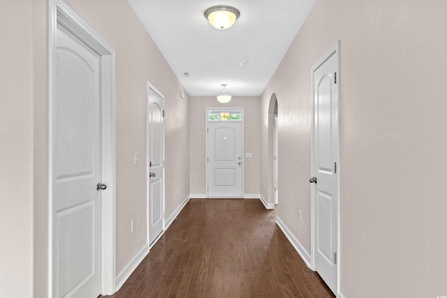 hall with dark hardwood / wood-style floors