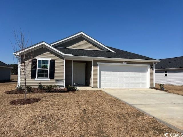 ranch-style home featuring driveway and an attached garage