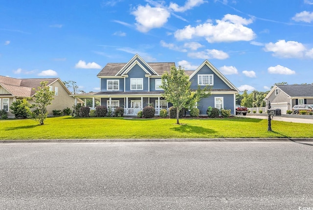 craftsman-style home with a porch and a front yard