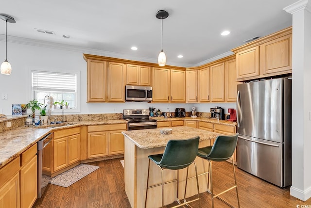 kitchen featuring sink, ornamental molding, decorative light fixtures, dark hardwood / wood-style flooring, and stainless steel appliances