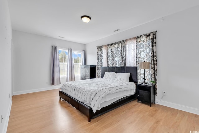 bedroom with light wood-type flooring