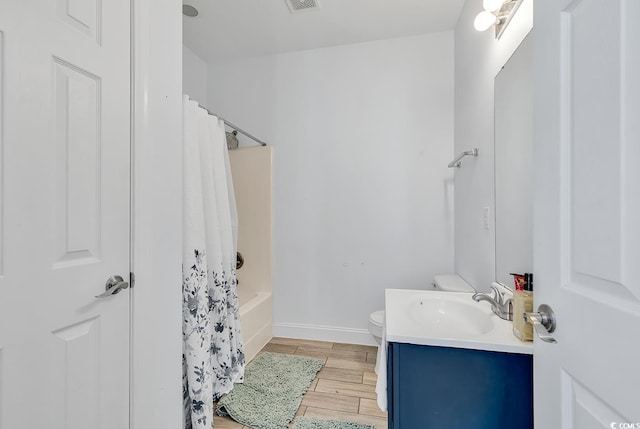 full bathroom featuring vanity, toilet, and shower / tub combo