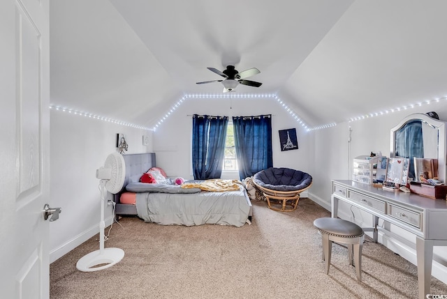 carpeted bedroom featuring ceiling fan and vaulted ceiling