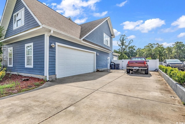 view of side of property featuring a garage