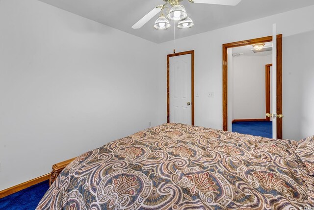 bedroom with ceiling fan and carpet floors