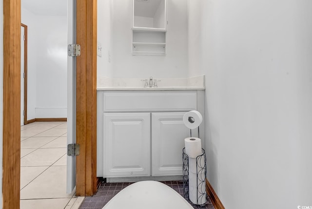 bathroom featuring tile patterned flooring and vanity