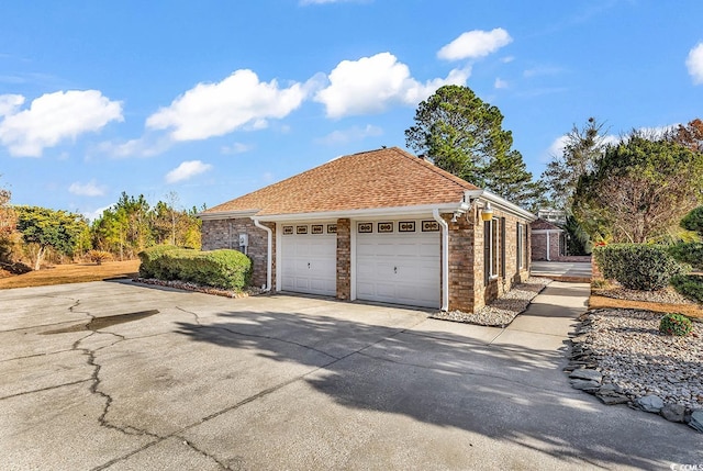 view of side of property featuring a garage