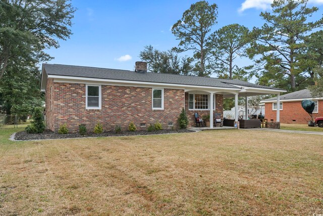 single story home with an outdoor living space and a front yard