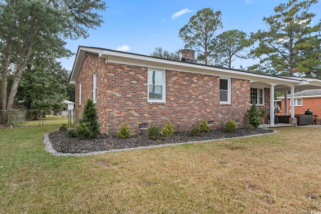 view of property exterior featuring a lawn and covered porch