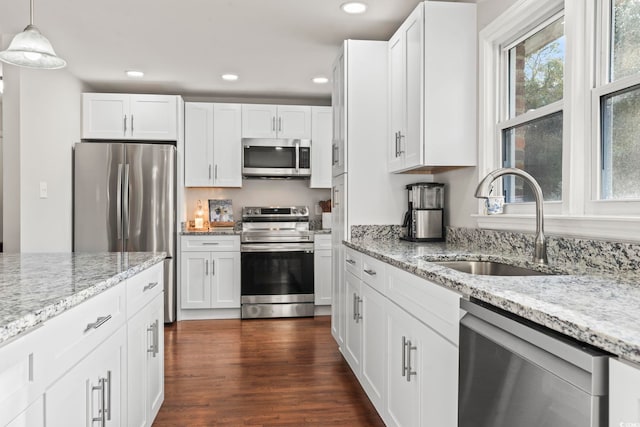 1673 Middleton St, Georgetown, SC 29440 - kitchen featuring stainless steel appliances, a sink, recessed lighting, white cabinetry, and light stone counters