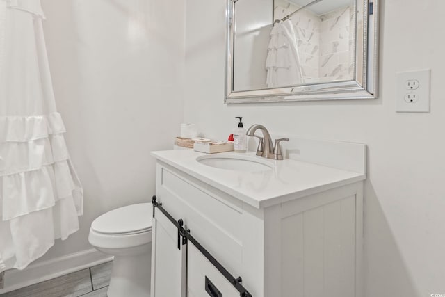 bathroom with vanity and toilet