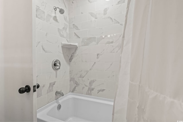 bathroom featuring shower / bathtub combination with curtain