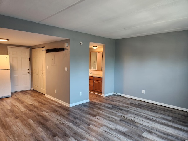 spare room with hardwood / wood-style flooring