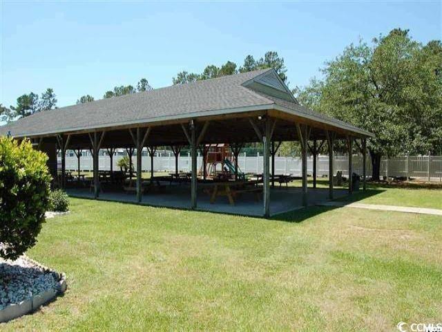 view of property's community featuring a gazebo and a lawn