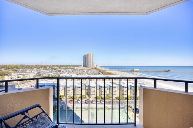 balcony with a view of the beach and a water view