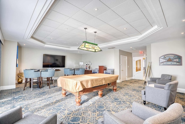 game room with carpet flooring and a raised ceiling